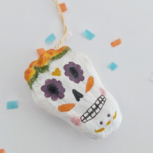 Load image into Gallery viewer, A closer view of the details on a spun cotton sugar skull. Pic 4 of 5.