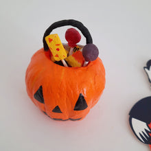 Cargar imagen en el visor de la galería, A closer view of the spun cotton sweets inside a spun cotton jack-o-lantern bucket, sitting on a white background.