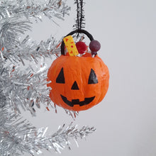 Cargar imagen en el visor de la galería, A vintage inspired spun cotton jack-o-lantern bucket filled with spun cotton treats, hanging on a silver tinsel tree.