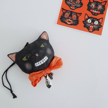 Load image into Gallery viewer, A vintage style, spun cotton black cat ornament laying by a print of an illustration of vintage black cats. Pic 6 of 6.
