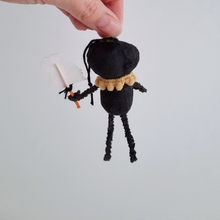 Load image into Gallery viewer, The back view of a vintage style, spun cotton black pumpkin man ornament. Pic 6 of 7.