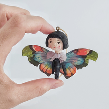 Load image into Gallery viewer, A vintage style spun cotton butterfly girl held in hand against a white background. Pic 1 of 1.