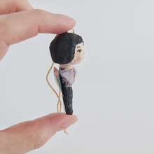 Load image into Gallery viewer, Another side view of vintage style spun cotton butterfly girl, held in hand against a white background. Pic 6 of 7.