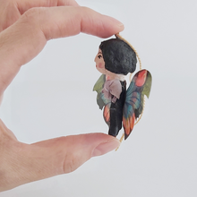 Load image into Gallery viewer, A side view of vintage style spun cotton butterfly girl, held in hand against a white background. Pic 5 of 7.