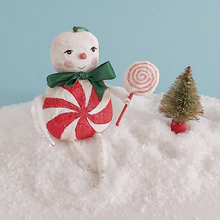 Load image into Gallery viewer, A vintage style spun cotton candy man Christmas ornament sitting on fake snow next to a mini bottle brush tree. Pic 3 of 8. 
