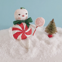 Load image into Gallery viewer, A vintage style spun cotton candy man Christmas ornament sitting on fake snow next to a mini bottle brush tree. Pic 3 of 8.