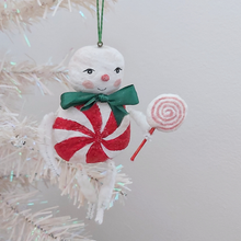 Load image into Gallery viewer, A vintage style spun cotton candy man Christmas ornament hanging from a white tree. Pic 4 of 8.