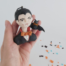 Load image into Gallery viewer, A vintage style spun cotton dracula ornament, sitting in a hand. Pic 2 of 8.