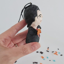 Load image into Gallery viewer, A side view of a vintage style spun cotton Dracula ornament, against a white background. Pic 6 of 8.