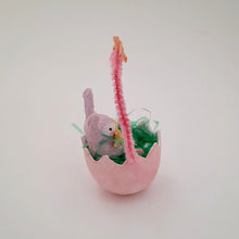 Load image into Gallery viewer, Another side view of a pink egg basket with spun cotton bunny inside on a white background