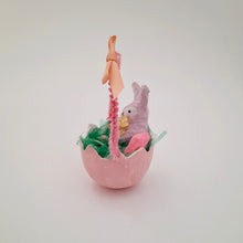 Load image into Gallery viewer, A side view of a pink egg basket with spun cotton bunny inside.