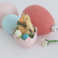 Load image into Gallery viewer, A vintage style spun cotton Easter chick ornament sitting in front of pink, blue and muted red egg ornaments. Pic 1 of 7.
