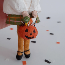 Load image into Gallery viewer, A closeup of a vintage style, spun cotton jack-o-lantern bucket with treats. Pic 3 of 7.