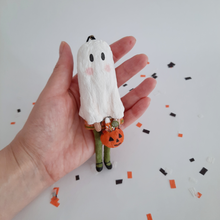 Cargar imagen en el visor de la galería, A hand holding a vintage style, spun cotton ghost girl ornament against a white background. Pic 2 of 8.