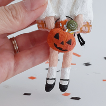 Load image into Gallery viewer, A close-up of a vintage style, spun cotton jack-o-lantern bucket against a white background. Pic 4 of 8.