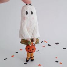 Load image into Gallery viewer, A vintage style, spun cotton ghost girl standing on Halloween confetti against a white background. Pic 1 of 7