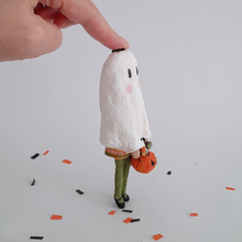 Cargar imagen en el visor de la galería, A side view of a vintage style, spun cotton ghost girl ornament on Halloween confetti against a white background. Pic 6 of 8.