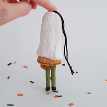 Cargar imagen en el visor de la galería, A back view of a vintage style, spun cotton ghost girl ornament on Halloween confetti against a white background. Pic 7 of 8.