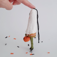 Cargar imagen en el visor de la galería, Another side view of a vintage style, spun cotton ghost girl ornament on Halloween confetti against a white background. Pic 8 of 8.