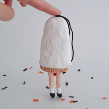 Load image into Gallery viewer, A back view of a vintage style, spun cotton ghost girl ornament on Halloween confetti against a white background. Pic 7 of 8.