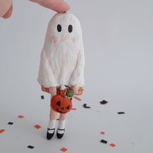 Load image into Gallery viewer, A vintage style, spun cotton ghost girl ornament on Halloween confetti against a white background. Pic 1 of 8.