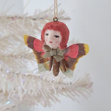 Load image into Gallery viewer, Another picture of spun cotton ginger butterfly girl hanging on a white tree. Pic 3 of 7.