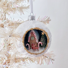 Load image into Gallery viewer, A vintage style spun cotton gingerbread diorama ornament hanging on a white tree. Pic 2 of 6.