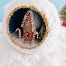 Load image into Gallery viewer, Another close-up of a vintage style spun cotton gingerbread house diorama ornament sitting on fake snow. Pic 4 of 6.