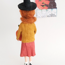 Load image into Gallery viewer, The back view of a vintage style, spun cotton Halloween girl art doll. Pic 7 of 7.