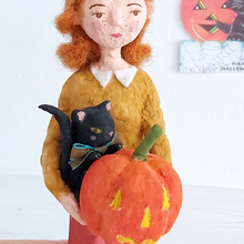 Load image into Gallery viewer, Close up of a spun cotton black cat and jack-o-lantern, held by a spun cotton Halloween girl art doll. Pic 3 of 7.