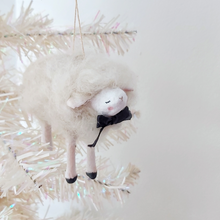 Load image into Gallery viewer, A white, spun cotton needle felted sheep ornament hanging from a white tree. Pic 2 of 6.