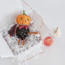 Load image into Gallery viewer, A vintage style spun cotton pinecone pumpkin man, sitting in a white gift box on white tissue shredding. Spun cotton orange and white pumpkins sit next to the box, on a white background. Pic 6 of 8.