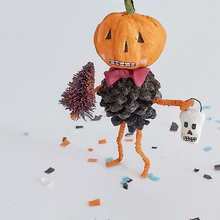 Load image into Gallery viewer, Vintage style spun cotton pinecone pumpkin man ornament standing on Halloween confetti on a white background. Pic 1 of 8.