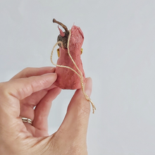 Cargar imagen en el visor de la galería, A back view of a vintage style spun cotton red squirrel, held in hand against a white background. Pic 8 of 9.