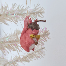 Cargar imagen en el visor de la galería, A vintage style spun cotton red squirrel ornament, hanging on a white tree against a white background. Pic 2 of 9.