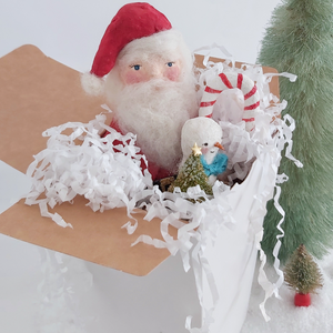 A vintage style spun cotton Santa art doll in a white gift box with white tissue shredding. Pic 5 of 9. 