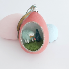 Load image into Gallery viewer, A vintage style spun cotton sheep diorama ornament sitting against pink and blue egg ornaments on a white background. Pic 3 of 6.
