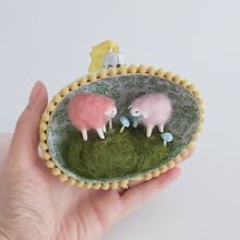 Load image into Gallery viewer, A vintage style spun cotton sheep egg diorama ornament held in a hand against a white background. Pic 3 of 6.