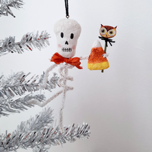 Load image into Gallery viewer, A vintage style, spun cotton pipe cleaner skeleton hanging on a silver tree. Pic 3 of 5.