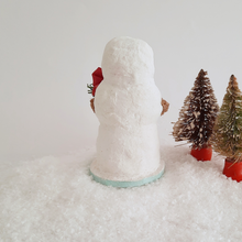 Load image into Gallery viewer, A back view of a vintage style, spun cotton snowman sitting next to two vintage bottlebrush trees. Pic 3 of 6.