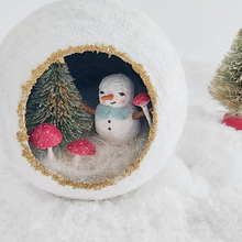 Load image into Gallery viewer, A close-up view of a vintage style spun cotton snowman diorama, with bottle brush tree and spun cotton red mushrooms. Pic 4 of 6.