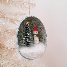 Load image into Gallery viewer, A vintage style, spun cotton snowman diorama ornament hanging from a white Christmas tree. Pic 4 of 6.