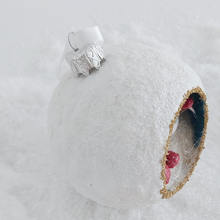 Load image into Gallery viewer, A close-up view of the vintage style silver ornament hanger on the top of the spun cotton snowman diorama ornament. Pic 6 of 6.
