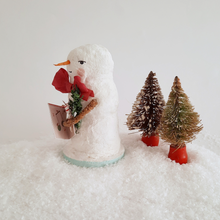 Load image into Gallery viewer, A side view of a vintage style, spun cotton snowman. Two vintage bottlebrush trees sit behind him. Pic 2 of 6.