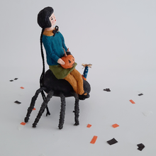 Load image into Gallery viewer, A side view of a vintage style, spun cotton girl sitting on the back of a spider. Pic 8 of 10.
