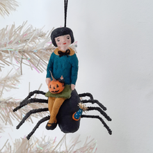 Load image into Gallery viewer, A vintage style, spun cotton girl sitting on a spider ornament, dangling from a tree. Pic 1 of 10.