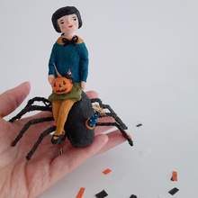 Load image into Gallery viewer, A vintage style, spun cotton spider girl ornament sitting in a hand against a white background. Pic 2 of 10.