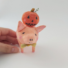 Load image into Gallery viewer, Hand touching spun cotton pig; size comparison. Photo 2