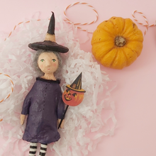 Load image into Gallery viewer, Spun cotton witch, laying on white shredded tissue paper. Photo 8 of 11.