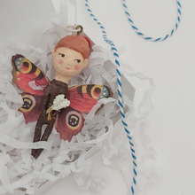 Load image into Gallery viewer, Spun cotton butterfly girl laying in gift box with shredded tissue paper. Pic 6 of 7.